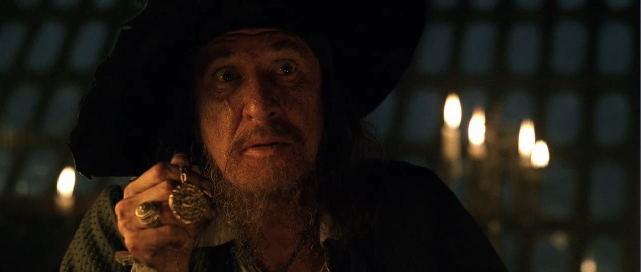 Элизабет Суонн Капитан Гектор Барбосса — Вы не знаете, что это такое? Верно?
— Пиратский медальон.
— Это ацтекское золото, одна из шестисот шестидесяти трёх бляшек, что индейцы отнесли Кортесу как выкуп... выкуп за кровь, доставленный с надеждой положить конец расправам. Но алчность Кортеса была неутолима, и тогда языческие боги придумали страшное проклятие. Любой из смертных, кто возьмёт хоть одну золотую бляшку, обречён на вечные муки.