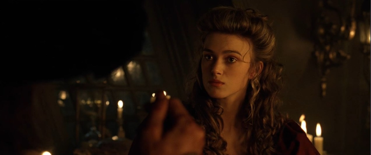 Элизабет Суонн Капитан Гектор Барбосса — Вы не знаете, что это такое? Верно?
— Пиратский медальон.
— Это ацтекское золото, одна из шестисот шестидесяти трёх бляшек, что индейцы отнесли Кортесу как выкуп... выкуп за кровь, доставленный с надеждой положить конец расправам. Но алчность Кортеса была неутолима, и тогда языческие боги придумали страшное проклятие. Любой из смертных, кто возьмёт хоть одну золотую бляшку, обречён на вечные муки.